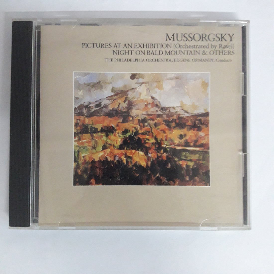 ซีดี Modest Mussorgsky, The Philadelphia Orchestra, Eugene Ormandy - Pictures At An Exhibition (Orchestration by Ravel) / Night On Bald Mountain & Others (CD) (VG+)