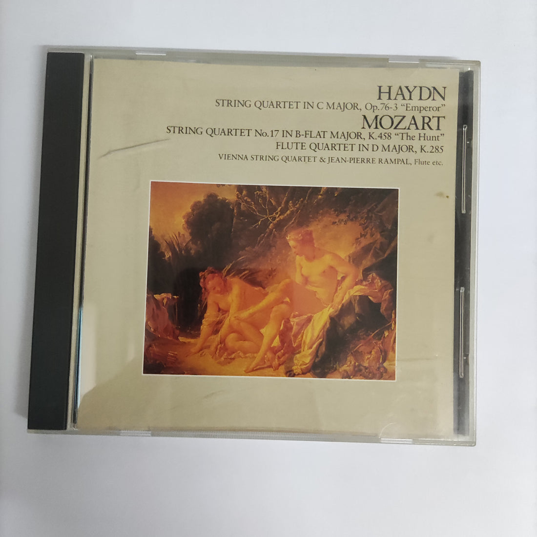 ซีดี Joseph Haydn, Wolfgang Amadeus Mozart, The Vienna String Quartet, Jean-Pierre Rampal - String Quartet In C Major No.7, Op.76-3 "Emperor" / String Quartet No.17 In B-Flat Major "The Hant" / Flute Quartet In D Major, K.285 (CD) (VG+)