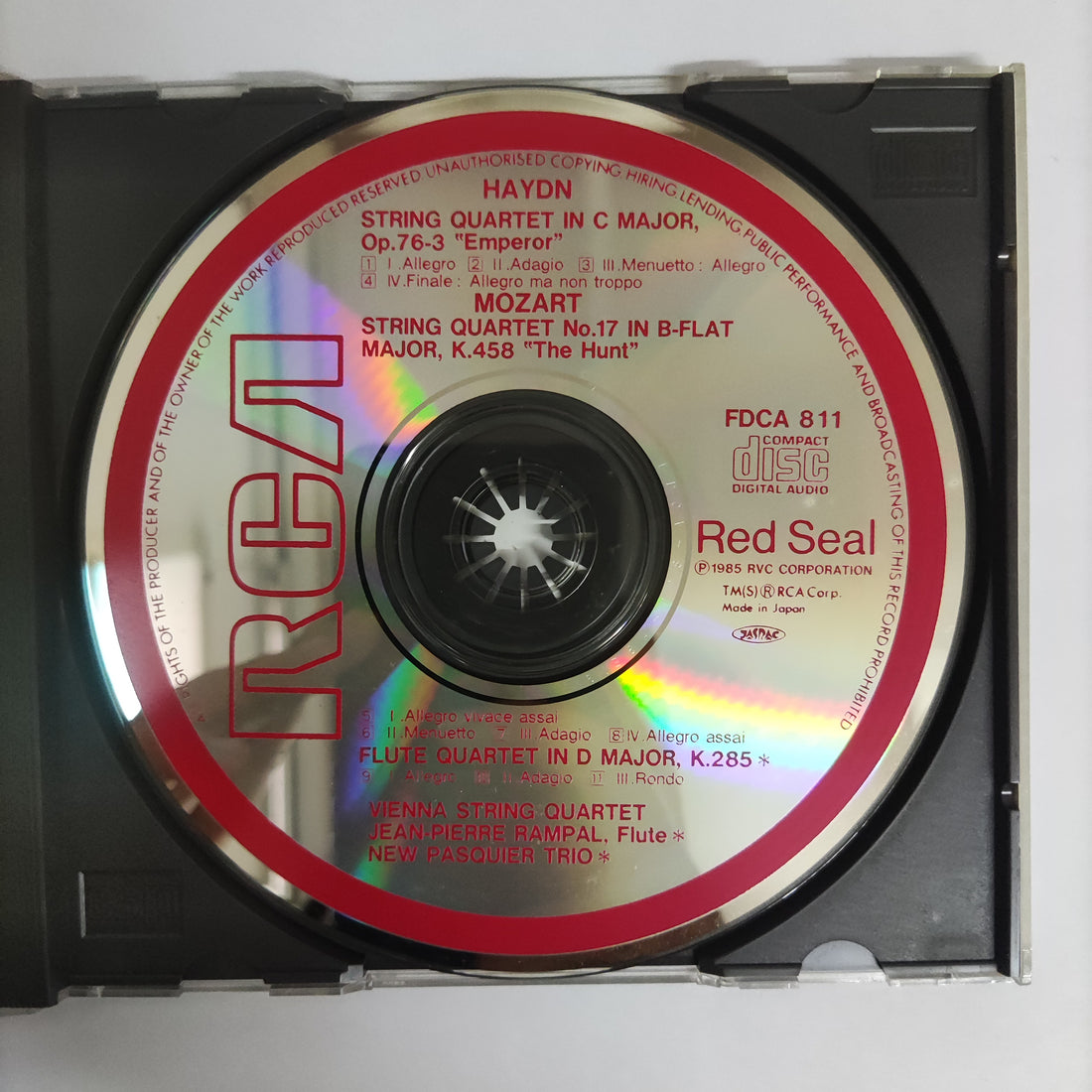 ซีดี Joseph Haydn, Wolfgang Amadeus Mozart, The Vienna String Quartet, Jean-Pierre Rampal - String Quartet In C Major No.7, Op.76-3 "Emperor" / String Quartet No.17 In B-Flat Major "The Hant" / Flute Quartet In D Major, K.285 (CD) (VG+)