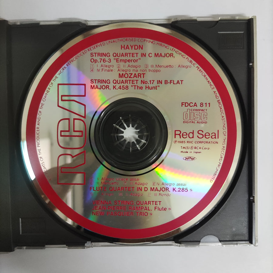 ซีดี Joseph Haydn, Wolfgang Amadeus Mozart, The Vienna String Quartet, Jean-Pierre Rampal - String Quartet In C Major No.7, Op.76-3 "Emperor" / String Quartet No.17 In B-Flat Major "The Hant" / Flute Quartet In D Major, K.285 (CD) (VG+)